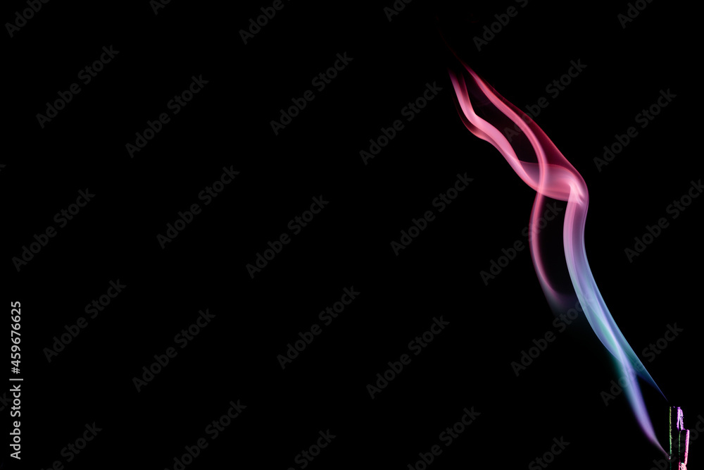 Abstract colorful smoke on a black background. Isolated.