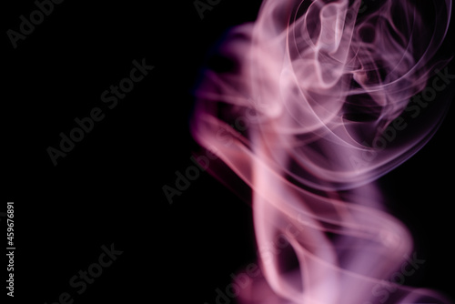 Abstract colorful smoke on a black background. Isolated.