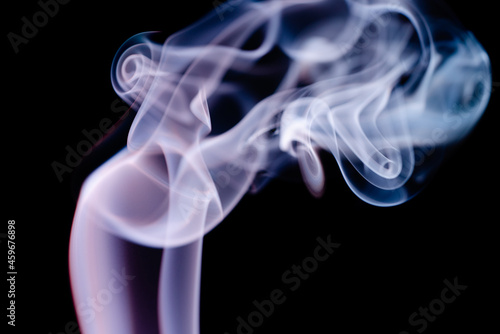 Abstract colorful smoke on a black background. Isolated.