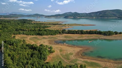Aerial drone top down photo of beautiful artificial lake of Plastiras or Tavropos with wonderful nature and famous outdoor and water activities like canoe and water bike  Thessaly  Greece 