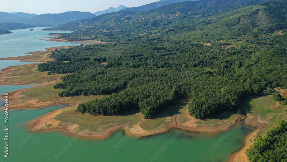 Aerial drone top down photo of beautiful artificial lake of Plastiras or Tavropos with wonderful nature and famous outdoor and water activities like canoe and water bike, Thessaly, Greece Aerial drone top down photo of beautiful artificial lake of Plastiras or Tavropos with wonderful nature and famous outdoor and water activities like canoe and water bike, Thessaly, Greece