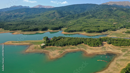 Aerial drone top down photo of beautiful artificial lake of Plastiras or Tavropos with wonderful nature and famous outdoor and water activities like canoe and water bike, Thessaly, Greece  photo