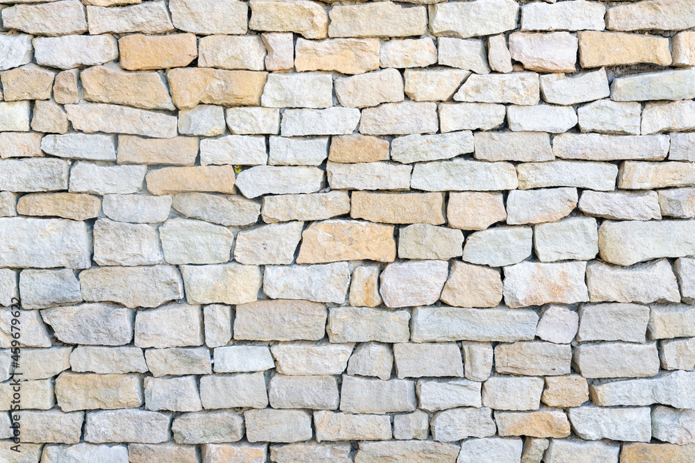 Texture of even masonry fence or horizontal surface.