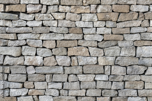 Texture of even masonry fence or horizontal surface.
