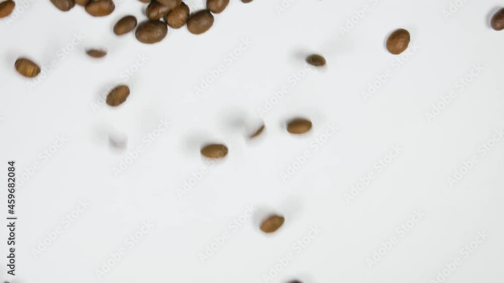 The coffee beans spin rotate quickly fast fly, dispart, splash to the sides with centrifugal coriolis force. The video is in reverse. Twist, create pattern, make design picture. Pressurized air wind. The coffee beans spin rotate quickly fast fly, dispart, splash to the sides with centrifugal coriolis force. The video is in reverse. Twist, create pattern, make design picture. Pressurized air wind.