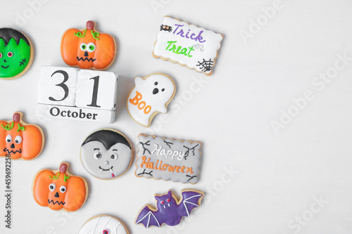 Halloween funny Cookies with 31 October calendar on white background. Trick or Threat  Happy Halloween  Hello October  fall autumn  Festive  party and holiday concept