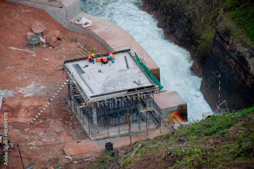 The building under construction is attached to the water source.