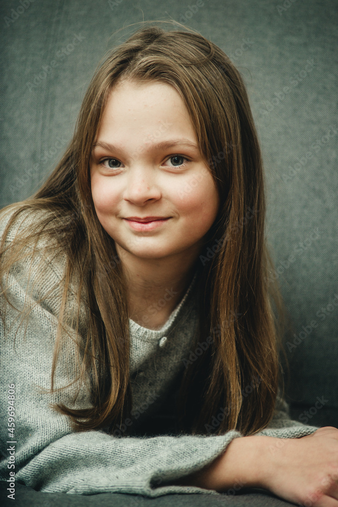 portrait of a teenage girl on a gray background portrait of a teenage girl on a gray background