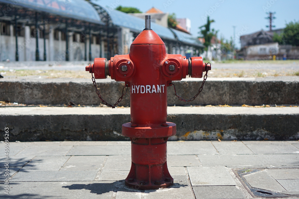 Red hydrant on the sidewalk