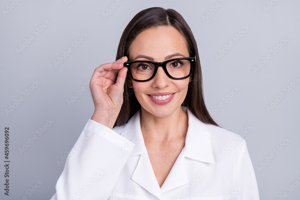 Photo of mature attractive woman happy positive smile pediatrician clinic isolated over grey color background Photo of mature attractive woman happy positive smile pediatrician clinic isolated over grey color background
