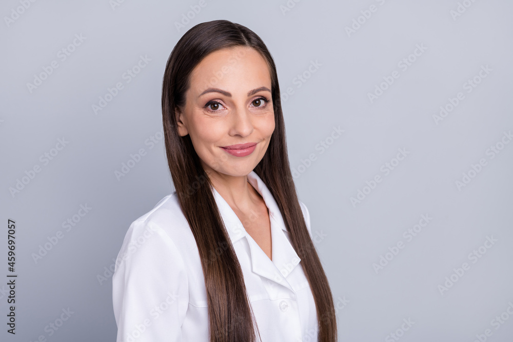 Profile side photo of mature attractive woman doctor happy positive smile surgeon health care isolated over grey color background Profile side photo of mature attractive woman doctor happy positive smile surgeon health care isolated over grey color background