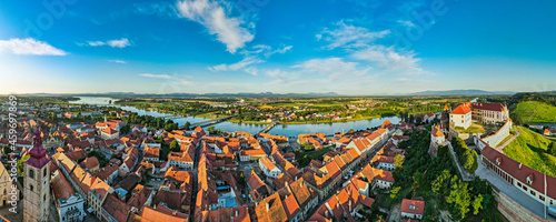 Aerial Panorama over Ptuj Townscape, Ptuj Castle and River Drava in Slovenia