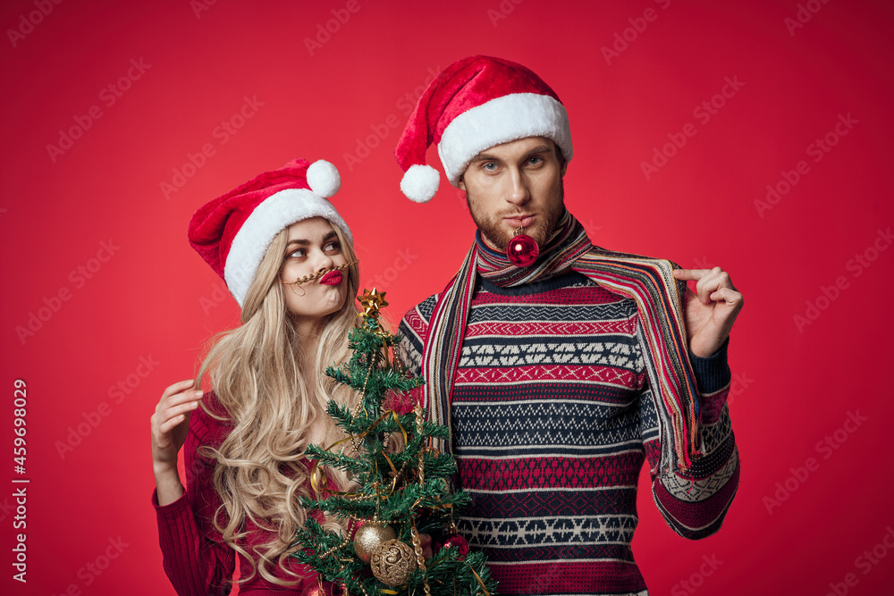 man and woman new year celebration together christmas red background man and woman new year celebration together christmas red background