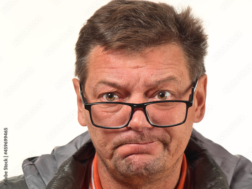 old not shaved man in glasses with facial expressions close-up old not shaved man in glasses with facial expressions close-up