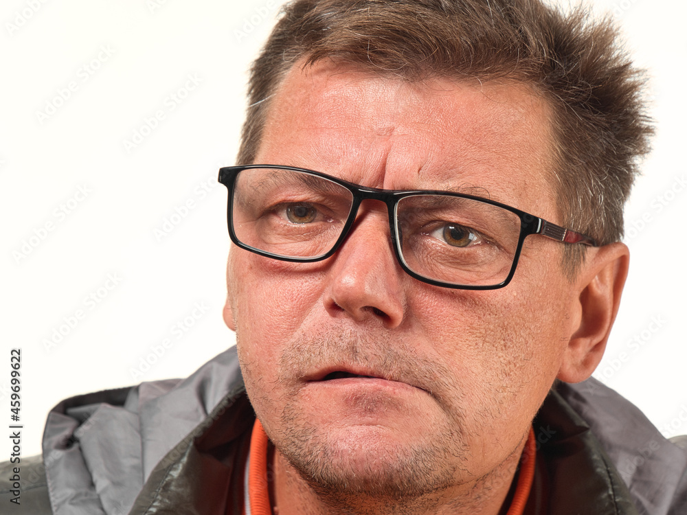 old not shaved man in glasses with facial expressions close-up old not shaved man in glasses with facial expressions close-up