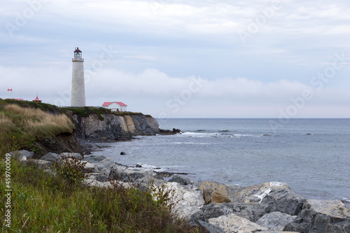 The 1858 lighthouse in Cap-des-Rosiers, the tallest in the country, seen during a grey morning, Gaspé, Quebec Canada