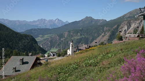 Beautiful panoramic view of Chamois and its surroundings, including the church and the chairlift to Lake Lod, Aosta Valley, Italy