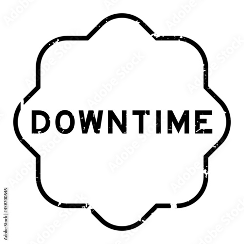 Grunge black downtime word rubber seal stamp on white background