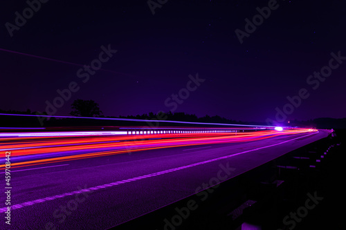 Night road lights. Lights of moving cars at night. long exposure red, blue, green