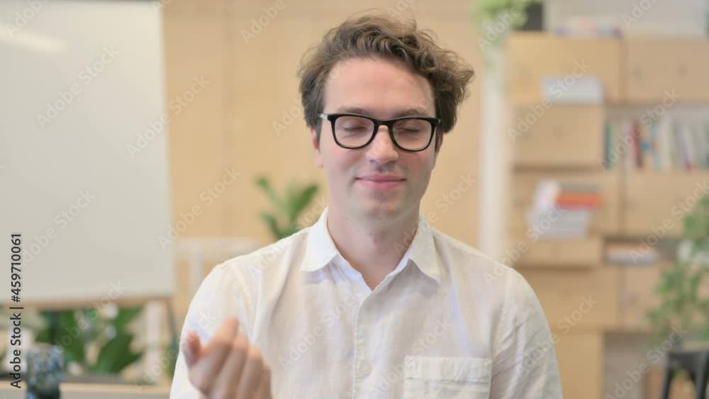 Portrait of Young Man Pointing at the Camera and Inviting Portrait of Young Man Pointing at the Camera and Inviting