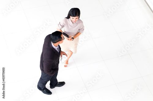 Business woman walking and asking for advice his work with boss at office.