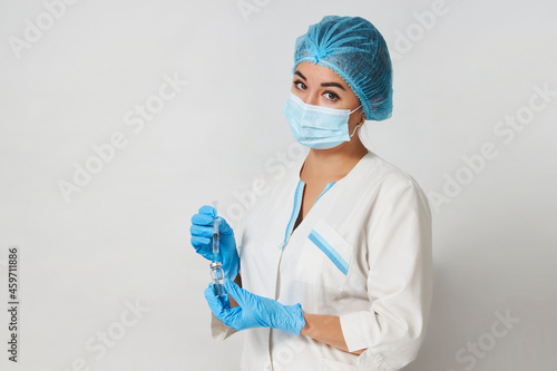 Female doctor injecting injection vaccine, close-up