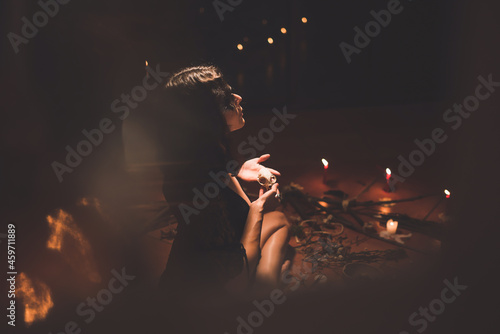 Witch casting spell during ritual photo