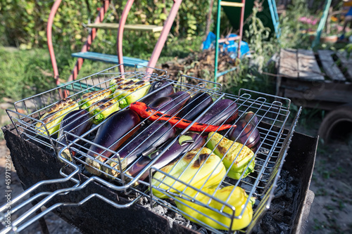 Grilling on coals vegetables for hot salad