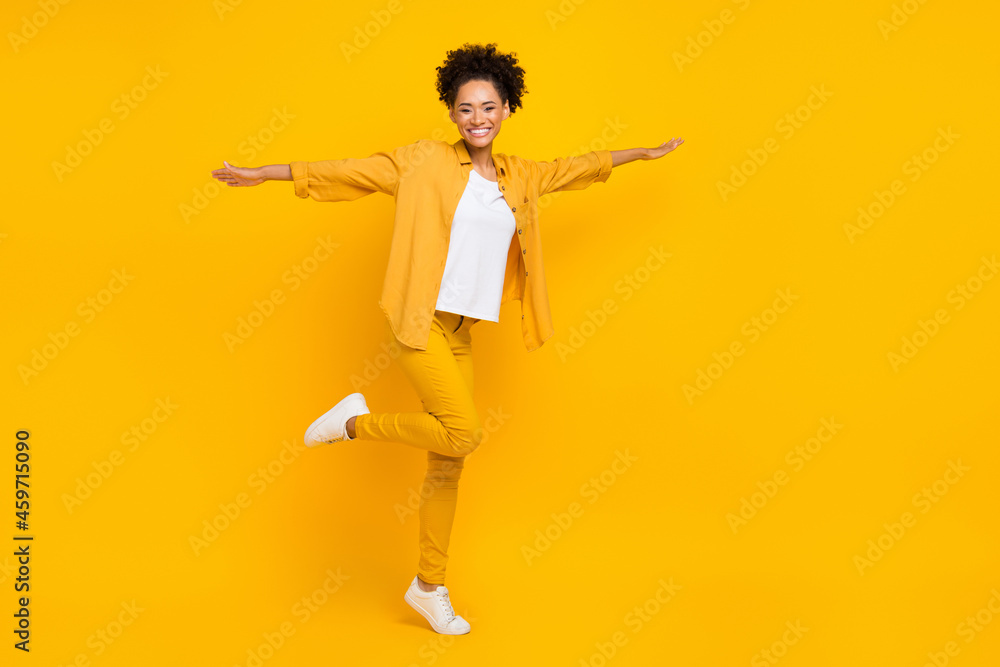 Full length body size photo woman wearing yellow clothes laughing playful isolated bright yellow color background Full length body size photo woman wearing yellow clothes laughing playful isolated bright yellow color background