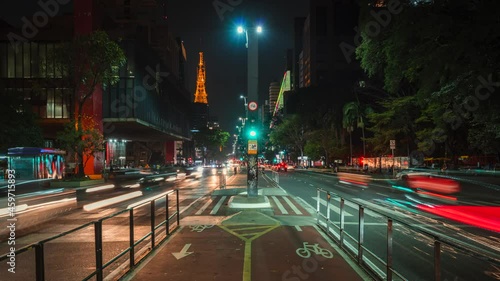 Timelapse view of night traffic on Paulista Avenue (Portuguese: Avenida Paulista) in Sao Paulo, the business and financial centre of Brazil and largest city in South America. photo