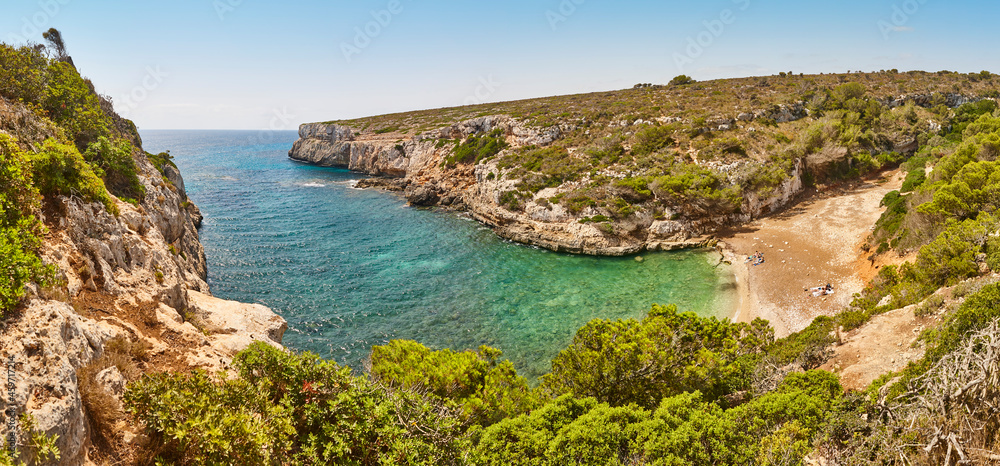 Turquoise waters in Mallorca. Bota cove. Panoramic mediterranean coastline. Balearic