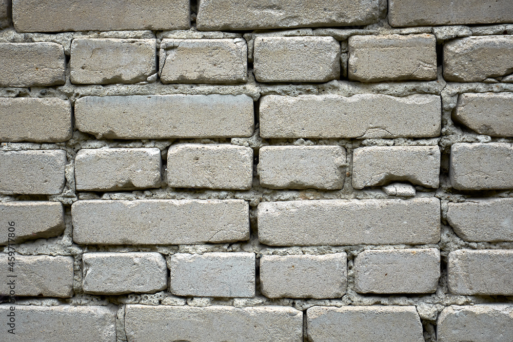 Fototapeta premium Gray brick masonry. Brick wall