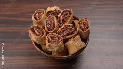 Indian traditional Snacks Bhakarvadi or Bakarvadi.Diwali snacks Bhakarwadi, selective focus photo