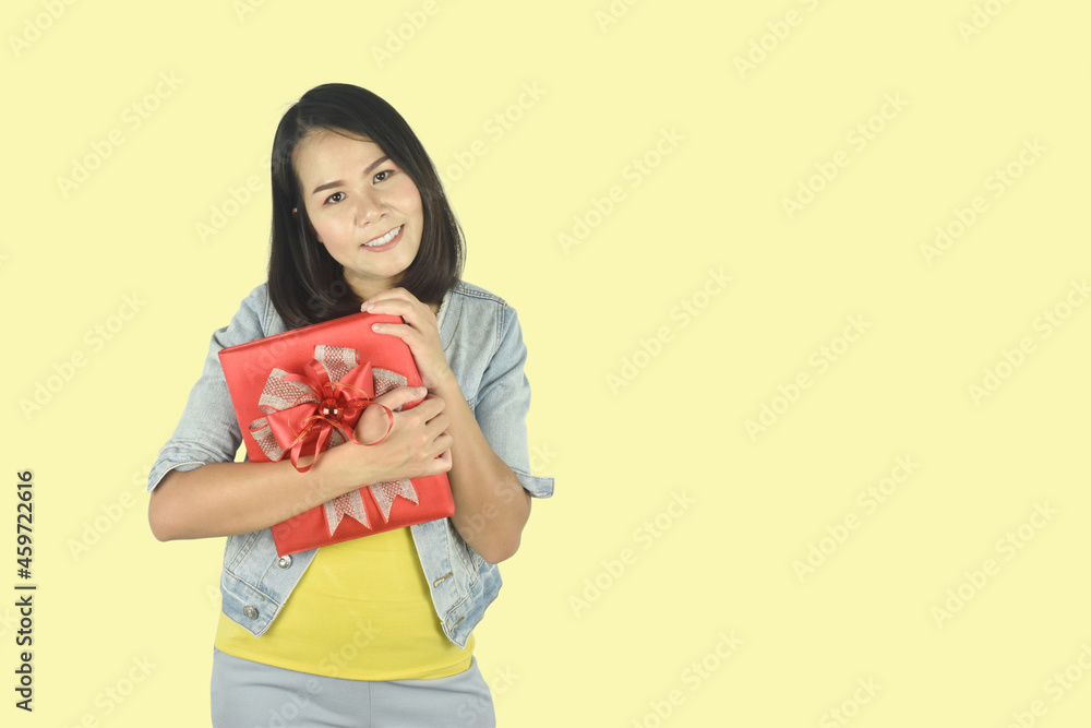 Portrait of happy young woman red gift box hugging gesture on white background. Present for birthday, valentine day, Christmas, New Year concept. Portrait of happy young woman red gift box hugging gesture on white background. Present for birthday, valentine day, Christmas, New Year concept.