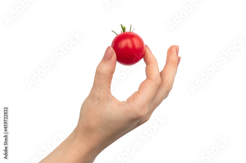 Fresh cherry tomatoes in hand isolated on a white background photo