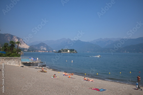 The beach on the lake shore, Stresa, Lombardy, Italy. photo