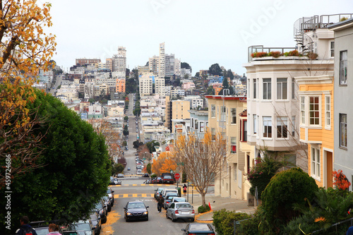 Fototapeta Naklejka Na Ścianę i Meble -  Historic residential buildings on Greenwich Street with Russian Hill at the background, view from the bottom of Telegraph Hill in city of San Francisco, California CA, USA. 