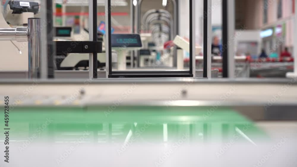Checkout counter in a supermarket without people. Shop before opening. Empty checkout counters in the store Checkout counter in a supermarket without people. Shop before opening. Empty checkout counters in the store