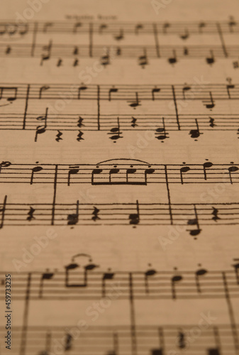 sheet music in the foreground with selective focus