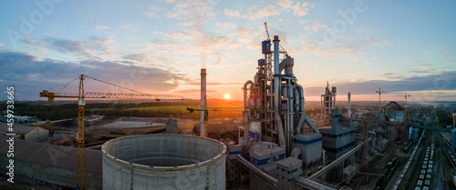 Fotografía Aerial view of cement factory tower with high concrete plant structure at industrial production area