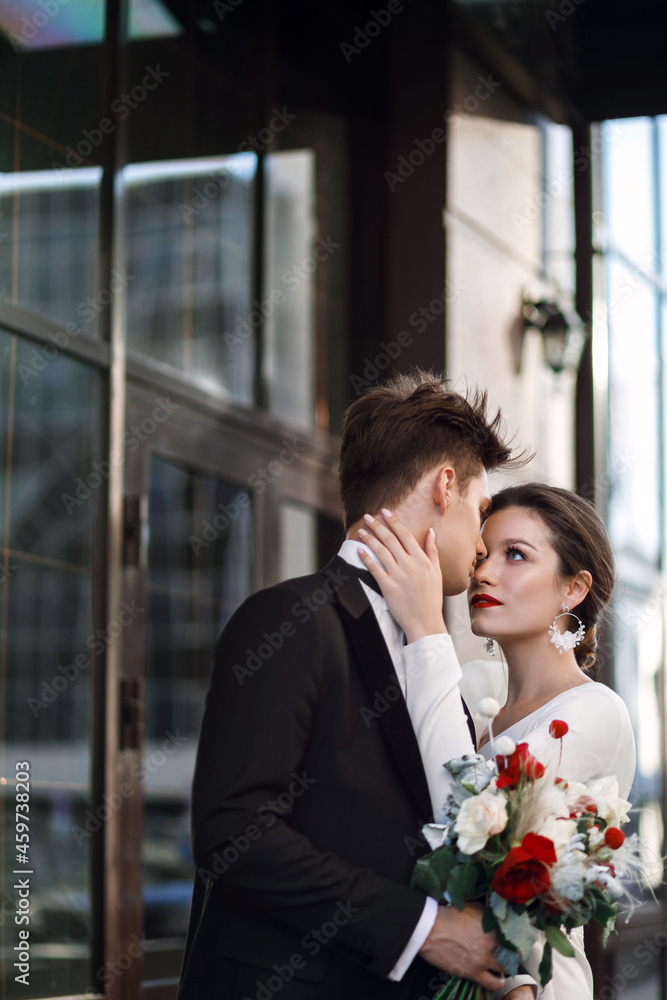 Portrait of a beautiful couple. Young and attractive woman and man looking at each other. Bride and groom