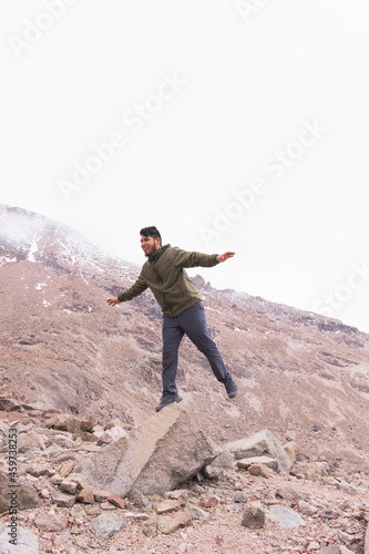 Adventure young man in the mountains.