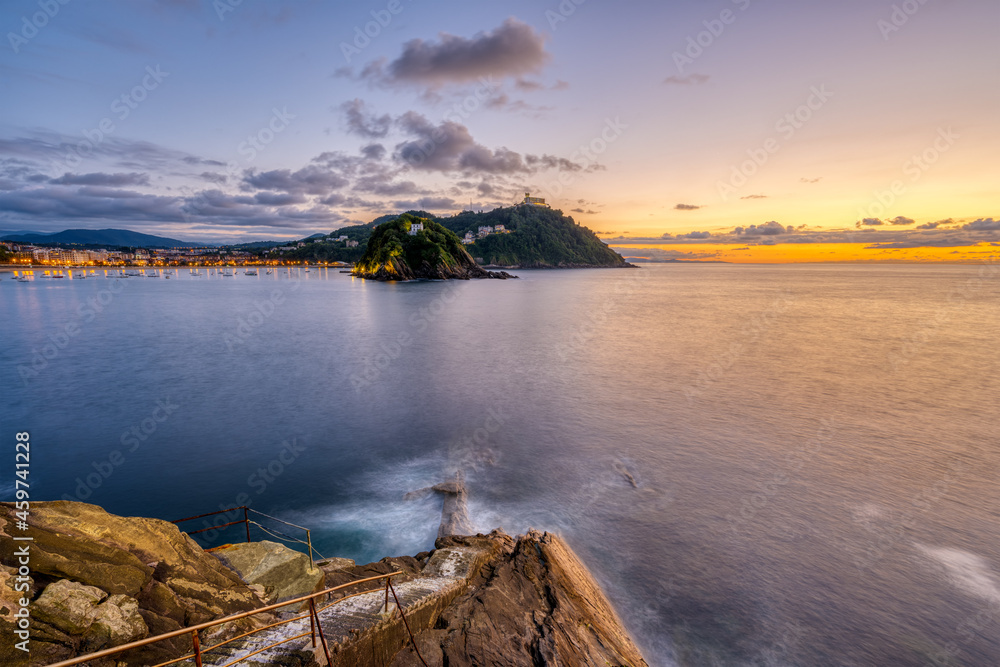 The bay of San Sebastian in Spain with Monte Igueldo at sunset