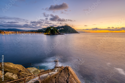 The bay of San Sebastian in Spain with Monte Igueldo at sunset