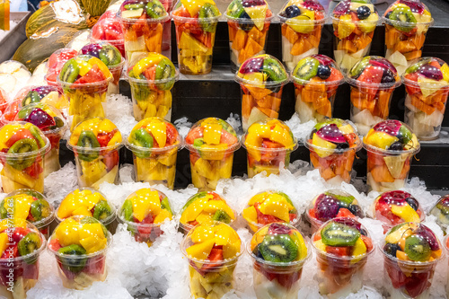 A variety of fruit salads at a market in Barcelona, Spain photo