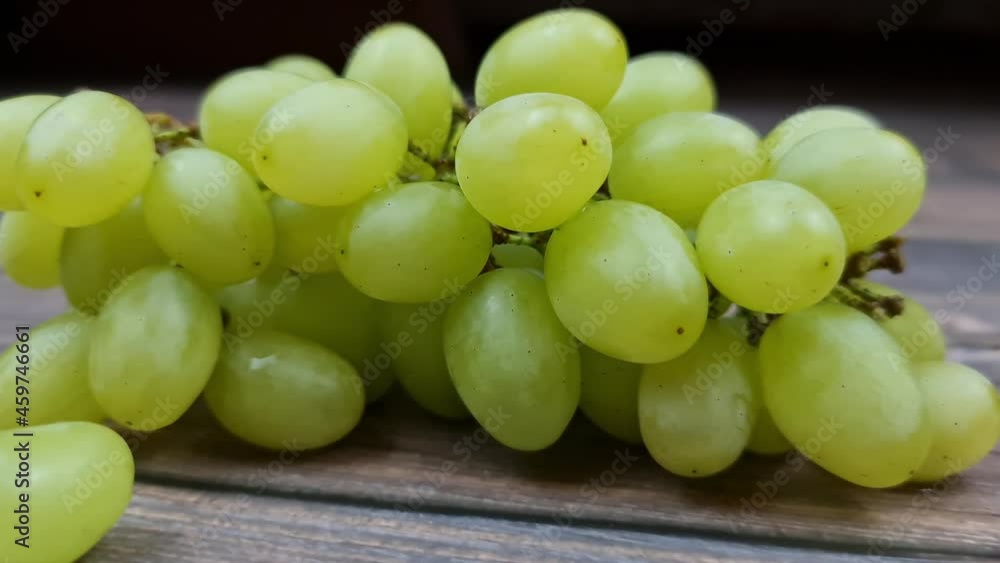 The Natural fresh green grapes close-up. Bunch of grapes. The Natural fresh green grapes close-up. Bunch of grapes.