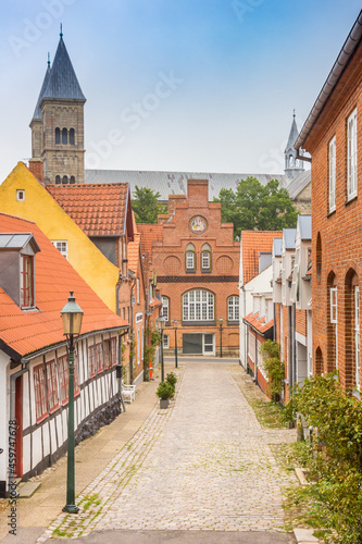 Street with old houses leading to the Domkirke church in Viborg  Denmark