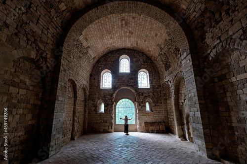 San Juan de la Peña, Aragon September 7, 2021, tourist inside the arched interior of the monastery of San Juan de la Peña, a Romanesque work in Huesca.