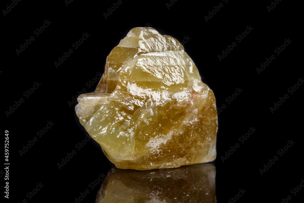 Macro mineral stone yellow Calcite on a black background Macro mineral stone yellow Calcite on a black background