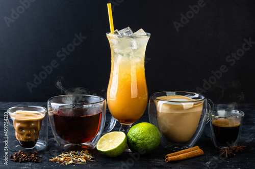 Set of scull glass with cofee, black tea, orange alcohol cocktail, cappuccino and espresso